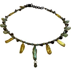 Lonnie Loveness, Boho beaded necklace gold, and green colors.